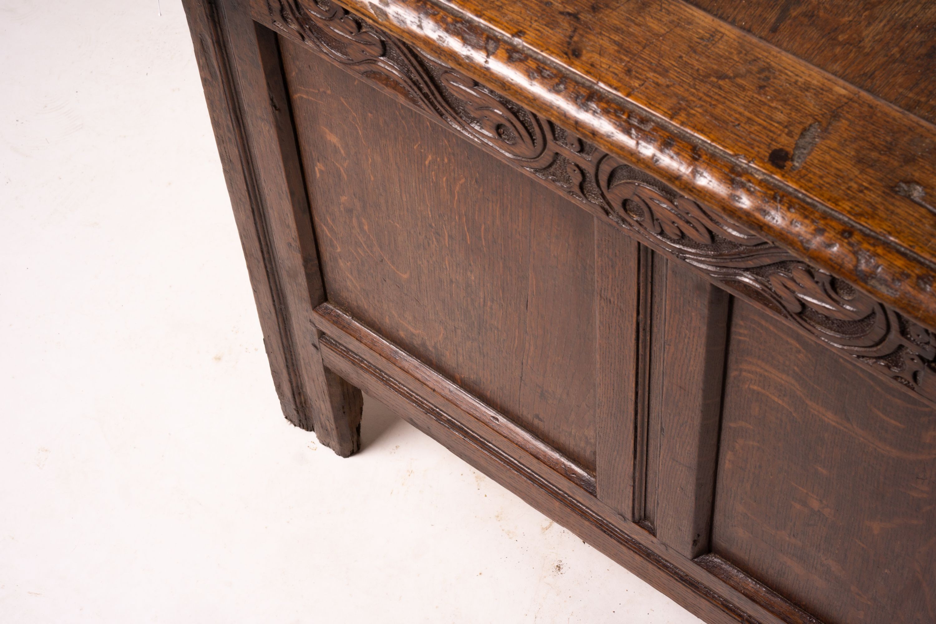 A 17th century panelled oak coffer, W.122cm D.55cm H.65cm